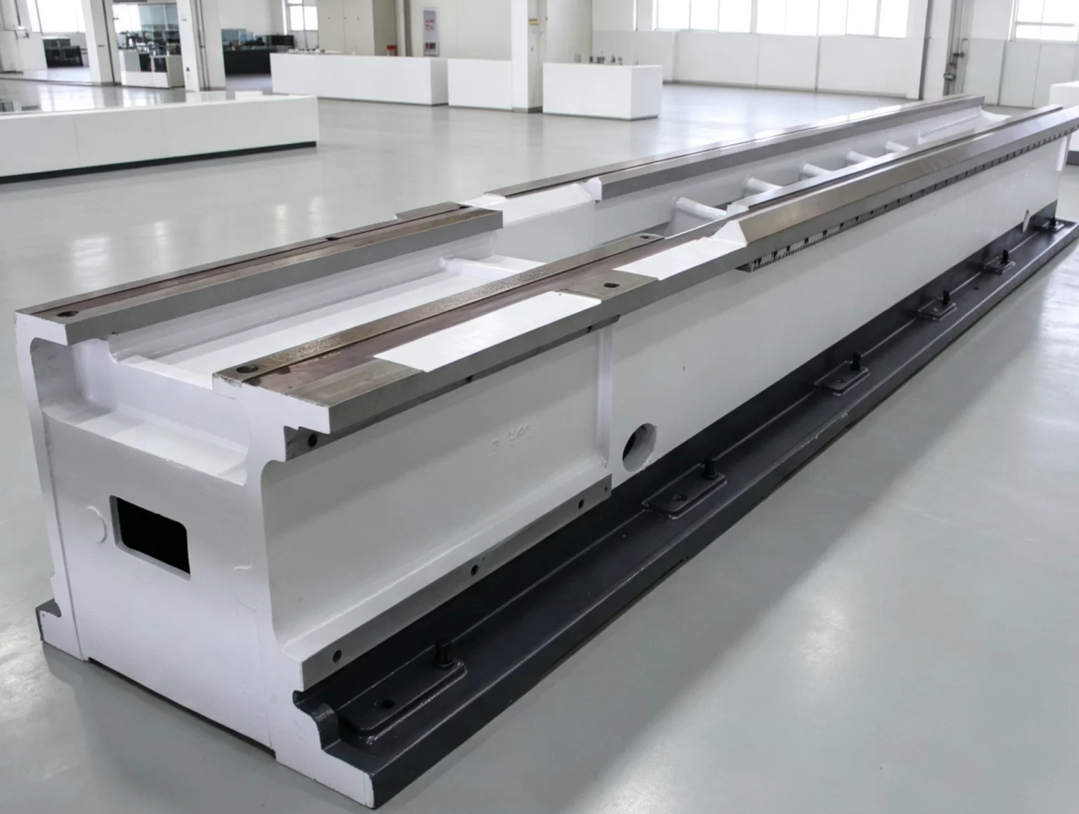 Ground and hardened guide rail of a CNC lathe bed, the surface that leveling and alignment measurements are referenced to